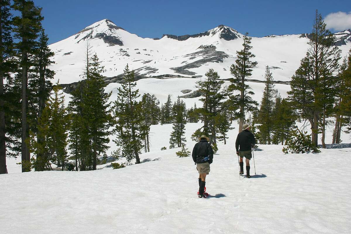 Hikers trek through the snow in the Desolation Wilderness near South Lake Tahoe.