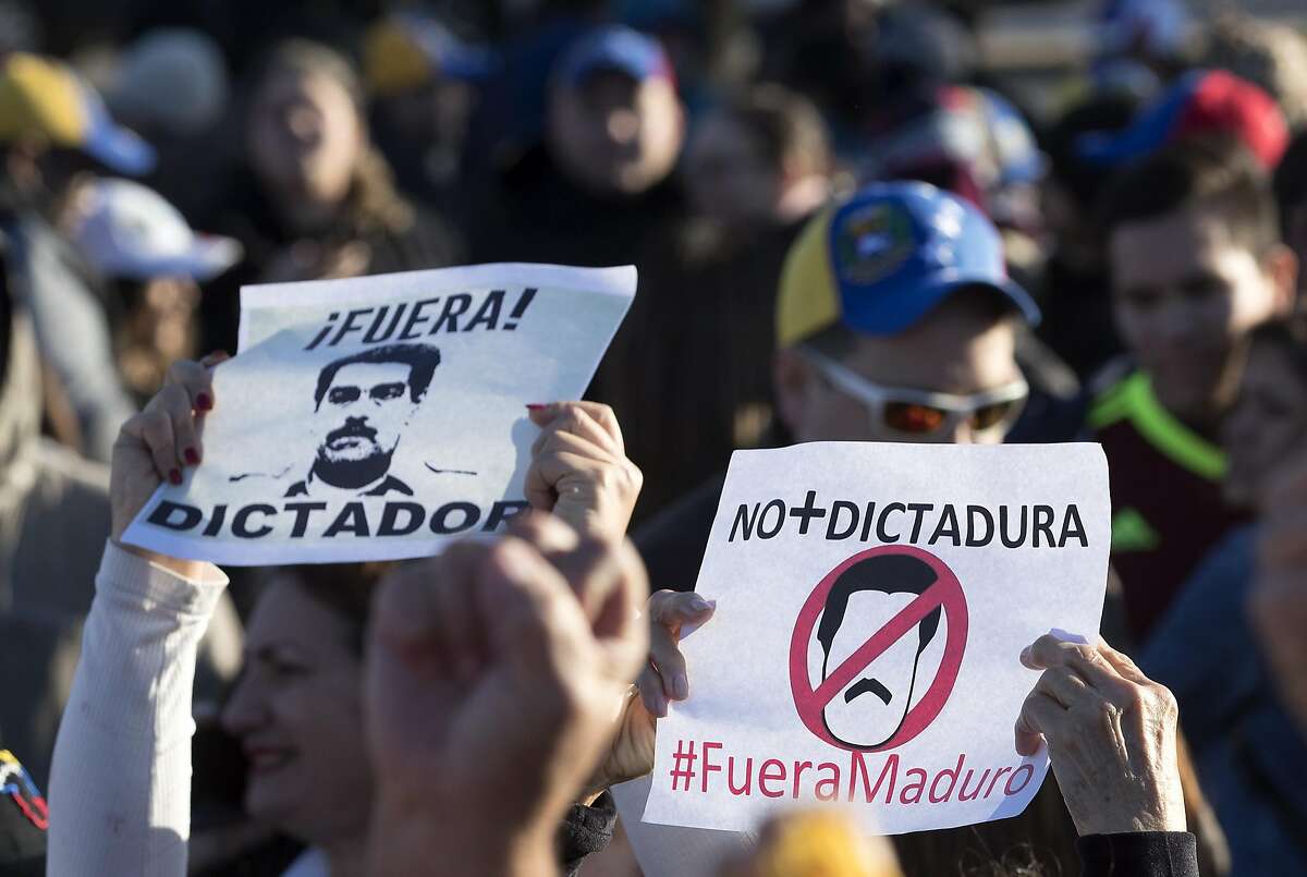 Local Venezuelans demonstrate in reaction to recent political happenings in their home country on Wednesday, Jan. 23, 2019, in Houston. The demonstrators are gathering in support of Opposition leader Juan Guaido, who swore himself in as President of Venezuela, and against President Nicolás Maduro. U.S. President Donald Trump announced today that he is recognizing Venezuelan opposition leader.