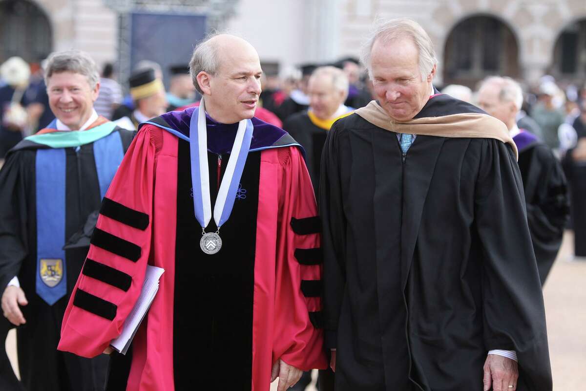 In this file photo from Friday, Oct. 12, 2012, Rice University President David Leebron and James Crownover, chairman of the Board of Trustees, talk as they leave the Centennial Address in the Academic Quadrangle at Rice University in Houston.