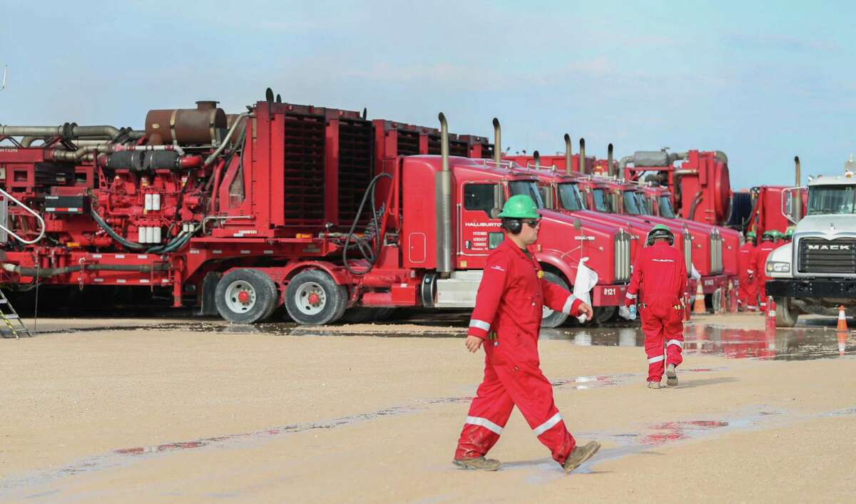 Halliburton hydraulic fracturing pumping units line a row near three pads Monday, June 26, 2017, in Midland.Lower prices for hydraulic fracturing services in North America continue to sting Houston-based company during the first quarter. 