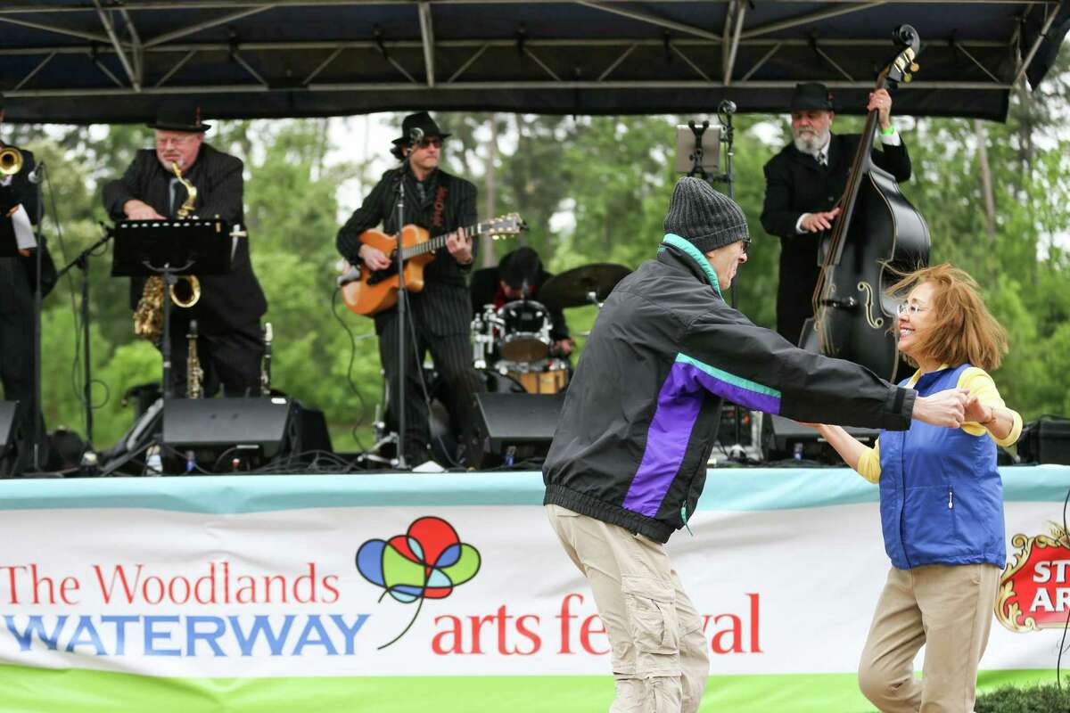 Porter residents Karl and Lupe Sharrah dance to music played by the Texas Gypsies during The Woodlands Waterway Arts Festival on Saturday, April 7, 2018, in The Woodlands. The 2021 The Waterway Arts Festival is scheduled for Saturday and Sunday, April 10-11, in Town Green Park. It will be an in-person festival after 2020 was canceled.