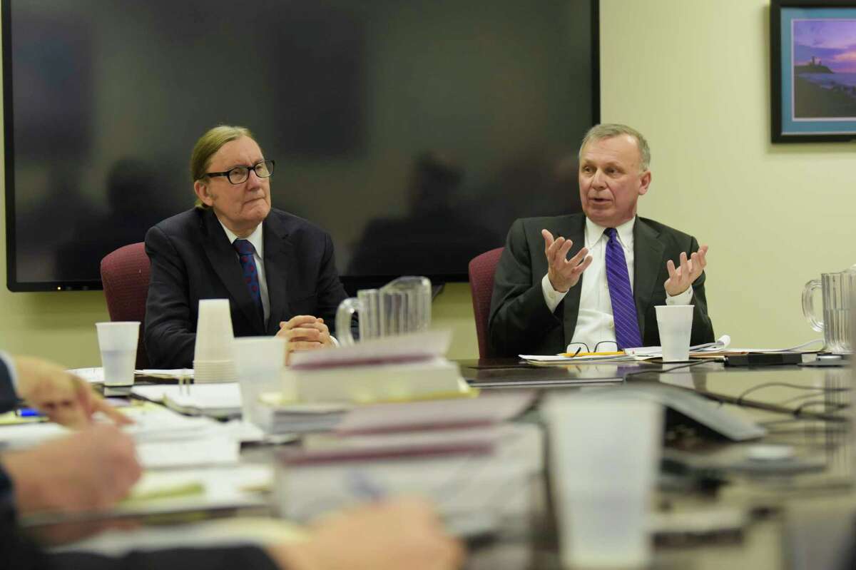 Co-chairs of the New York State Board of Elections, Douglas Kellner, left, and Peter Kosinsky, right, take part in a meeting at the Board of Elections on Thursday, Jan. 24, 2019, in Albany, N.Y. Enforcement counsel Risa Sugarman did not attend the meeting because of a lawsuit she filed against the commissioners' move to constrain her autonomy. (Paul Buckowski/Times Union)