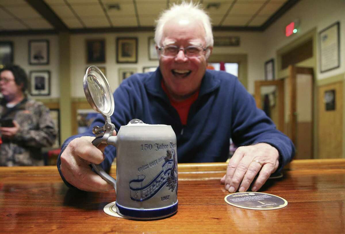 Donald Bushnell proudly shows his beer stein — an anniversary edition — for members of the German singing group, Beethoven Maennerchor, which as been around since 1867. The stein was produced in Germany to commemorate the group’s 150th anniversary.