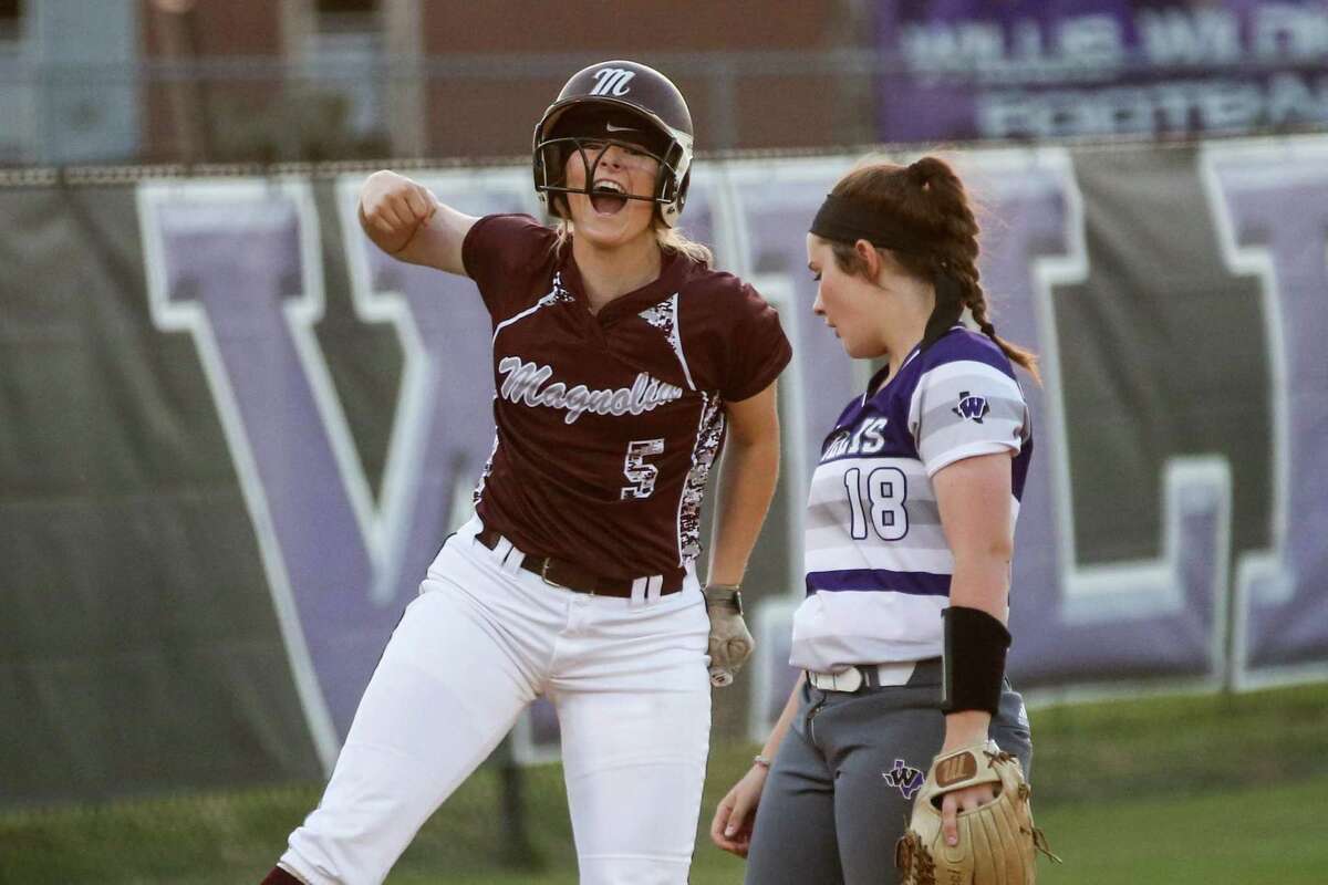 Magnolia's Julia Herzinger (5) reacts after making it to third base on an error at second during the softball game against Willis on Tuesday, April 17, 2018, at Willis High School. (Michael Minasi / Houston Chronicle)