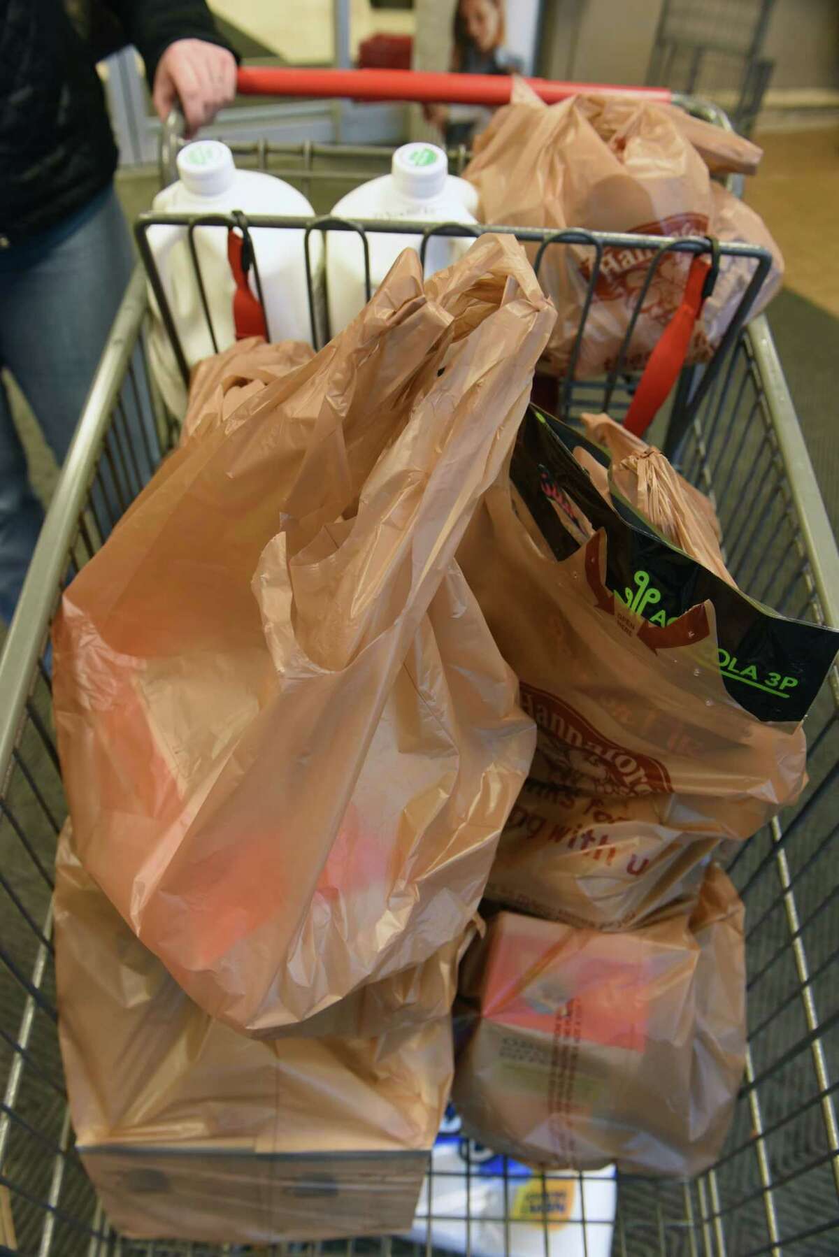 why are consumers paying for plastic shopping bags