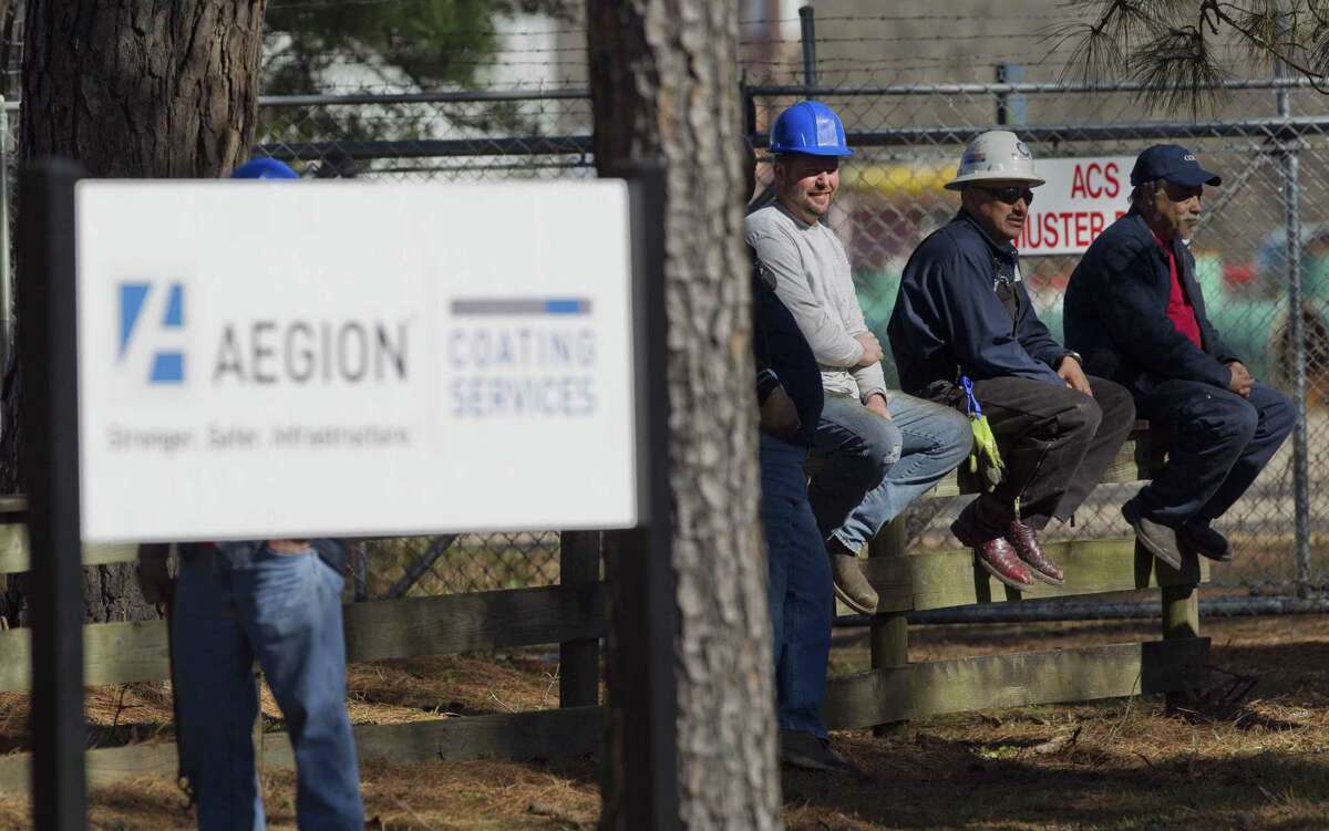 Employees are seen outside of Aegion Coating Services as Montgomery County emergency personnel respond to an industrial fire on Jefferson Chemical Road, Thursday, Jan. 24, 2019, in Conroe.