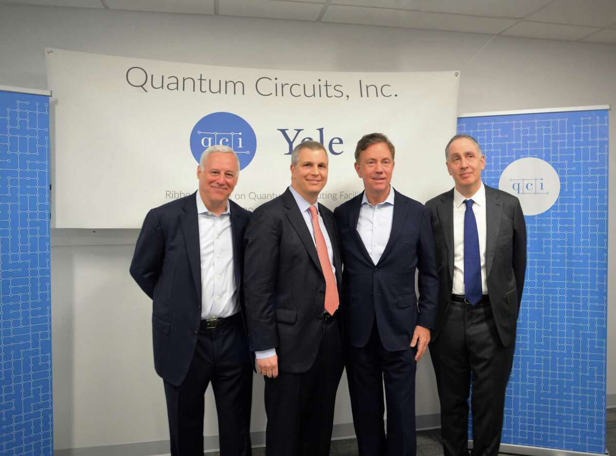 From left, Dan Ciporin, Robert Schoelkopf, Gov. Ned Lamont and Peter Schiffer attend a ribbon-cutting ceremony for Quantum Circuits Thursday in New Haven.