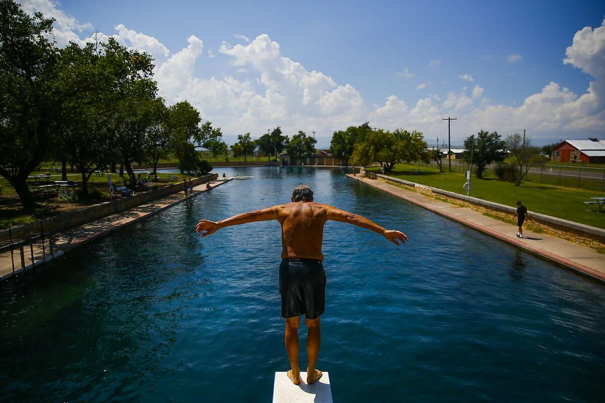 Doug Witkowski, from Dripping Springs, prepares to dive into the crystal clear waters of the worlds largest spring-fed swimming pool at Balmorhea State Park Friday, Sept. 16, 2016 four miles west of Balmorhea in Toyahvale, TX. Balmorhea State Park will be expanded after a 643-acre land acquisition recently was completed by the Texas Parks and Wildlife Department.