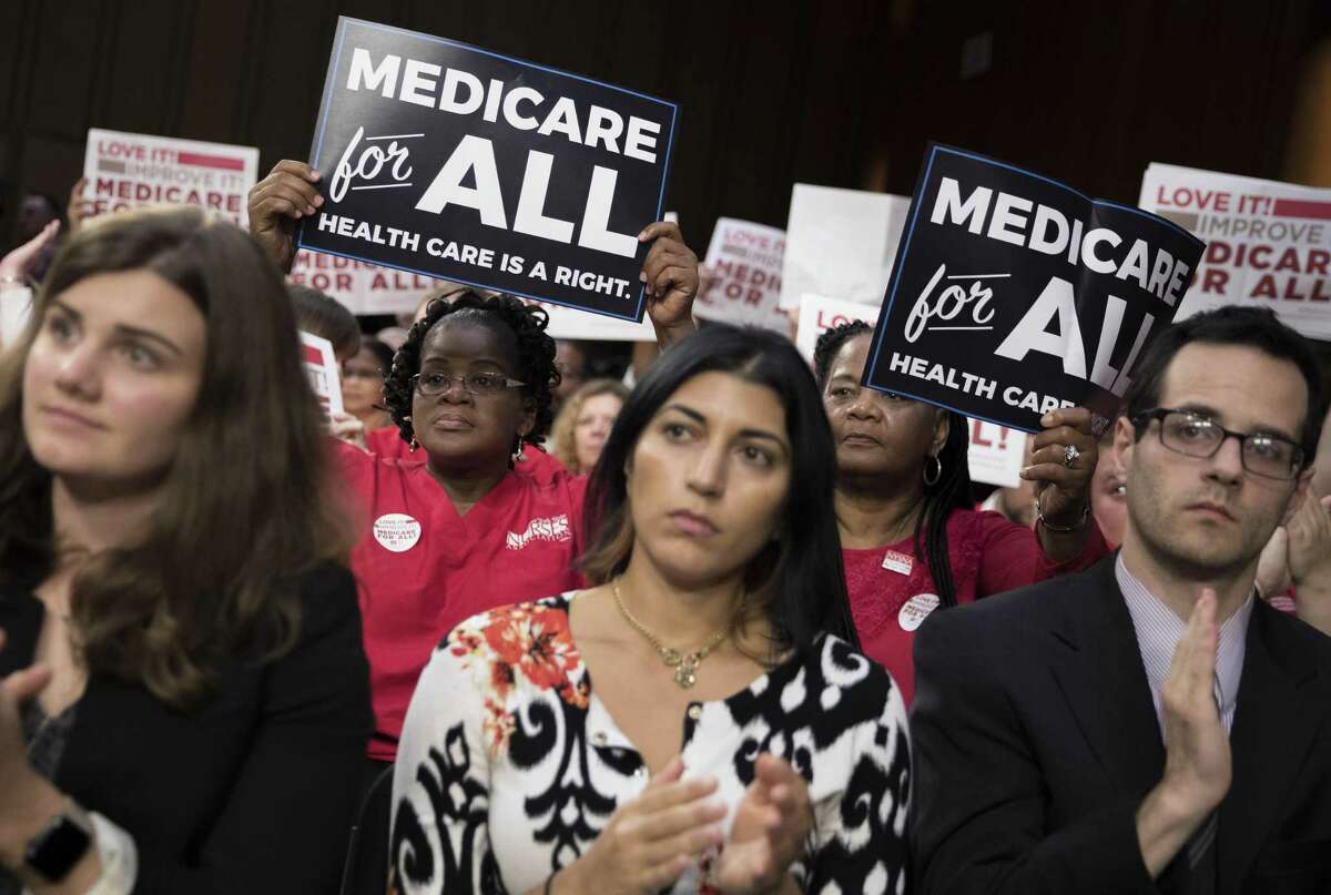 FILE — Members of National Nurses United at a speech by Sen. Bernie Sanders (I-Vt.) about health care on Capitol Hill in Washington, Sept. 13, 2017. A Medicare-for-all bill drafted by Sanders is gaining support among Democrats as they look ahead to the 2020 presidential race. (Tom Brenner/The New York Times)