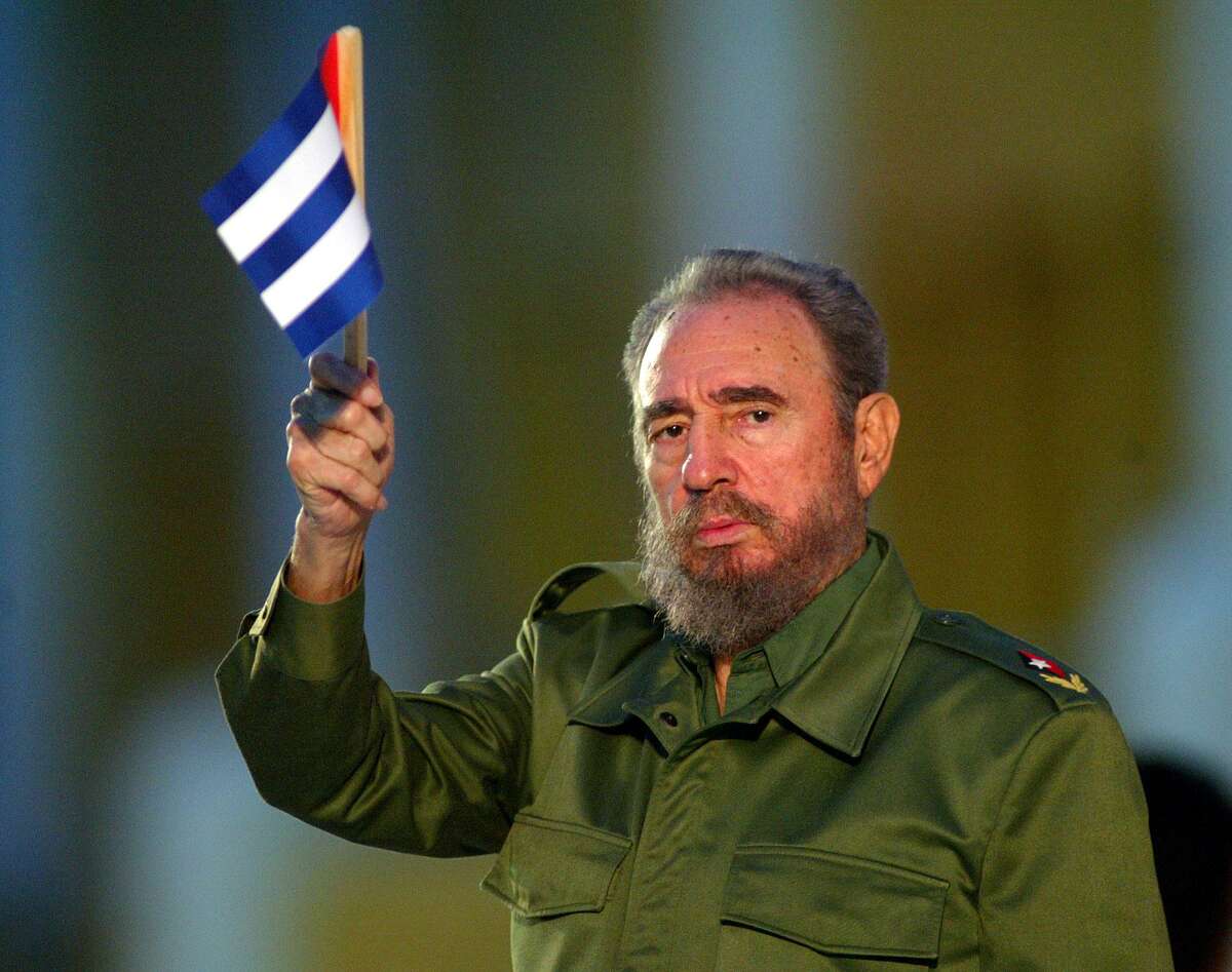 ** FILE ** Cuban President Fidel Castro holds a Cuban flag at the beginning of his speech in this Saturday July 26, 2003 file photo in Santiago de Cuba, eastern Cuba. Castro is in "very grave" condition after three failed operations and complications from an intestinal infection, a Spanish newspaper said Tuesday, Jan. 16, 2007. (AP Photo/Jose Goitia) Ran on: 01-18-2007 Fidel Castro is in very grave condi- tion after three failed opera- tions, a Span- ish newspaper reported.