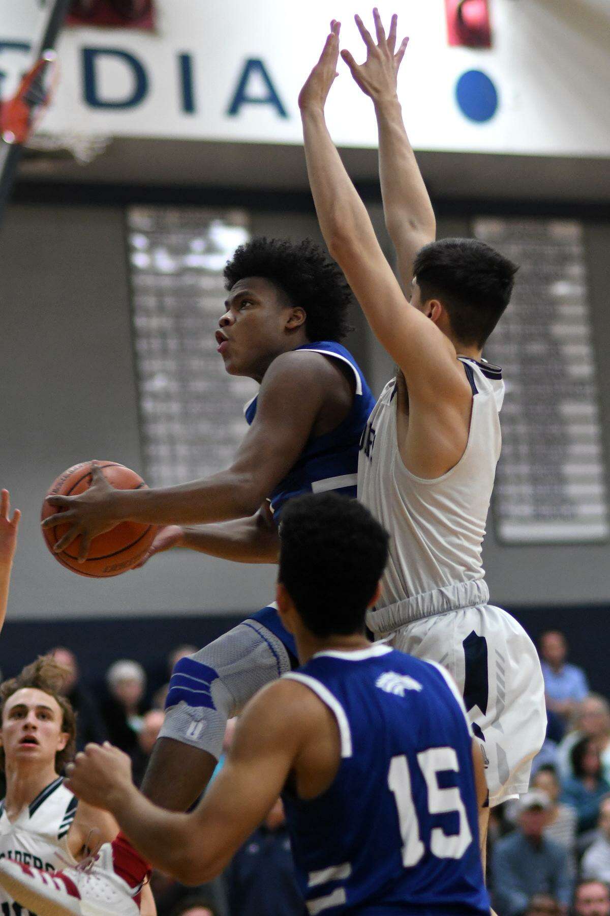 Houston Christian 5'10" senior point guard Sahvir Wheeler, left, skies to the hoop against Concordia Lutheran senior Evan Palmquist, right, in the 1st quarter of their Southwest Prep matchup at CLHS on Jan. 22, 2019.