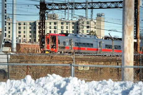 A Metro-North train passes through Bridgeport, Conn. Jan. 5, 2018, near the site of the proposed train station for the city’s East Side. Photo: Ned Gerard / Hearst Connecticut Media / Connecticut Post