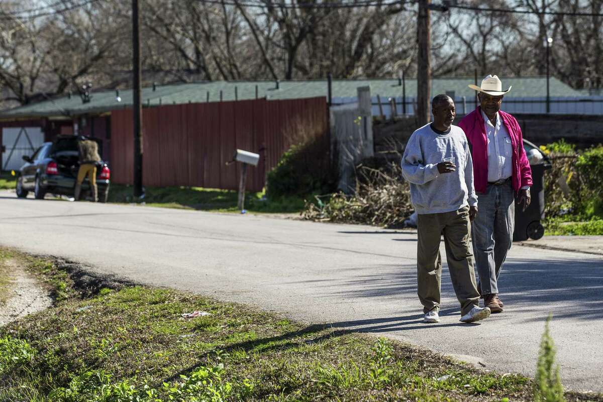 Prentise Prather, left, and Donald Glaze, walk along a street in the Settegast neighborhood on Thursday, Jan. 24, 2019, in Houston. Settegast is among the neighborhoods just north of I-610 where development is beginning to proceed at breakneck pace as region’s population, incomes and demand for housing increase.