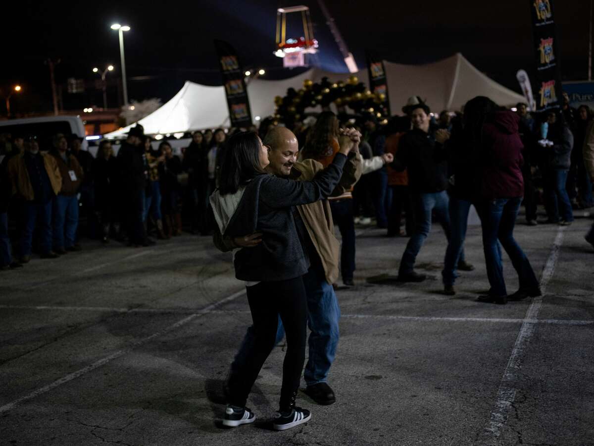 Carlos Sanchez dances with his daughter Lilandra Sanchez, 16, during the 41st annual San Antonio Cowboy Breakfast held outside Cowboys Dancehall in San Antonio, Texas on Friday, January 25, 2019. The Cowboy Breakfast started in 1979 and has continued until this year where it draws over 30,000 people for free tacos, coffee and other food to kick off the San Antonio Stock Show and Rodeo.