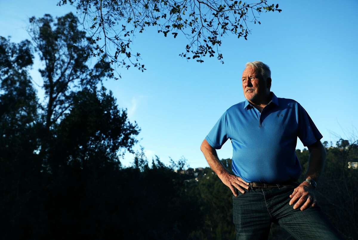 Mel Copland, a broker with Alain Pinel Realtors, poses for a portrait near his vacant lot on Oakwood Court in Montclair, Calif., on Wednesday, January 23, 2019. Oakland has a new tax on vacant properties. Starting this year, any property in Oakland that is used less than 50 days a year will be subject to a tax. This includes commercial, residential and raw land. There are some exceptions, such as for very low income people. The city sent a letter to property owners who may be subject to the tax and many are confused and upset. "I hope there's a class action lawsuit to stop this," said Copland, 71. "To be fair, I don't think they should take on an individual group of people to support the city of Oakland. If the voters vote on it, the whole city should pay for it. It should not be just people with vacant lots. You're taking on people, you know, had these lots for 30 some odd years. It's not fair."