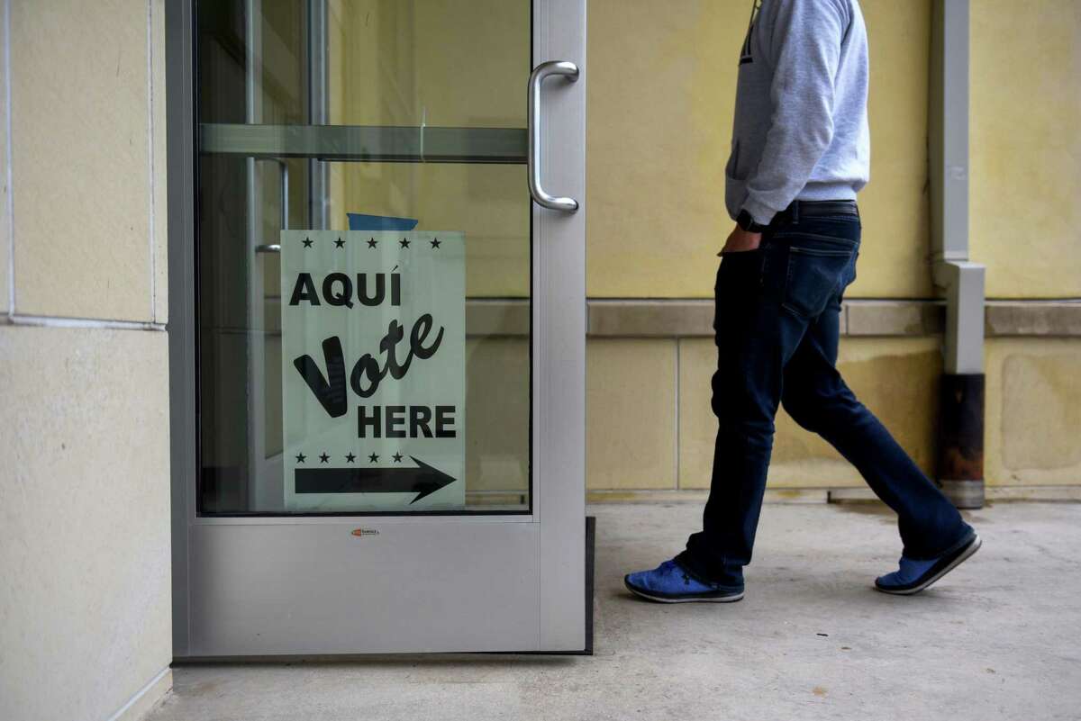 A resident arrives for early voting at a polling location in San Antonio, Texas, U.S., on Monday. Oct. 22, 2018. >>Here's what else you might want to keep in mind in order to not run afoul of state election laws...