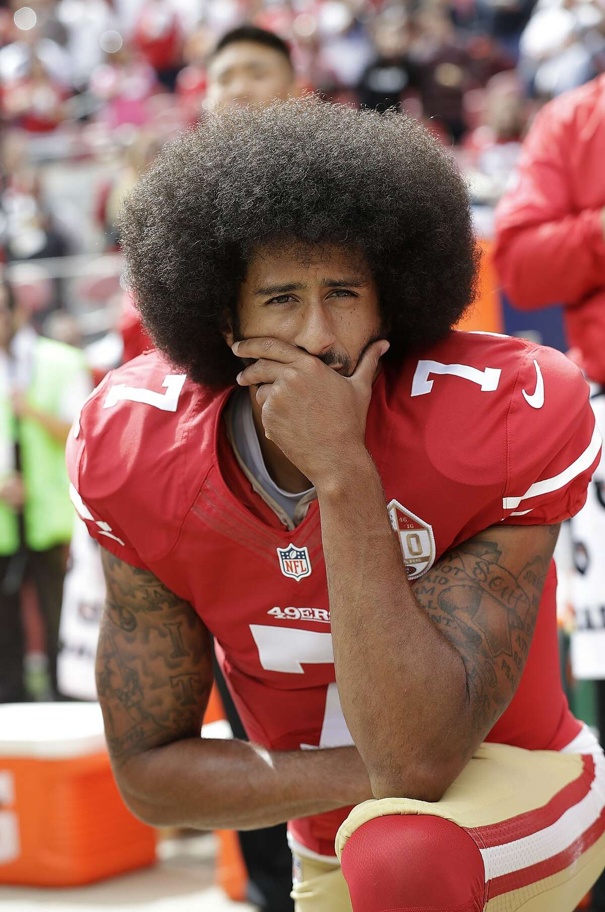 In this Oct. 2, 2016, file photo, then-San Francisco 49ers quarterback Colin Kaepernick kneels during the national anthem before an NFL football game against the Dallas Cowboys, in Santa Clara, Calif.