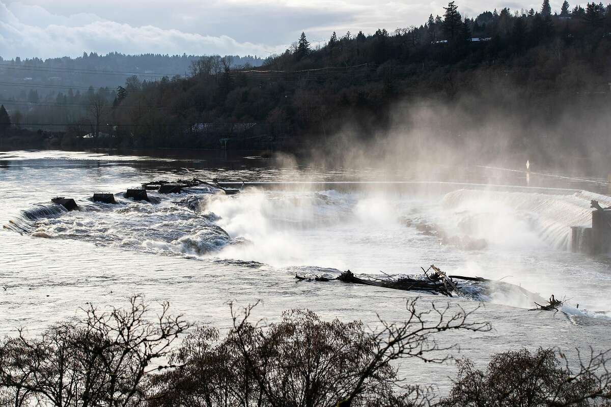 Spray rises from Willamette Falls on Monday, January 21, 2019, in Oregon City, Ore.