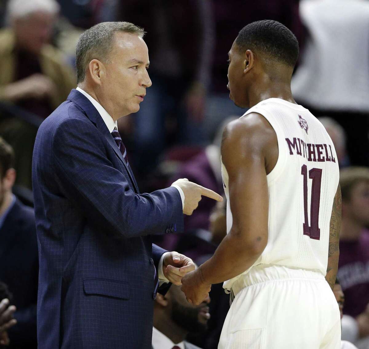 Texas A&M head coach Billy Kennedy talks with guard Wendell Mitchell (11) between plays during the first half of an NCAA college basketball game against Auburn, Wednesday, Jan. 16, 2019, in College Station, Texas. (AP Photo/Michael Wyke)