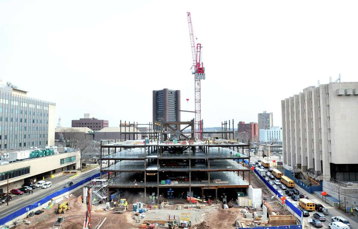 Steel is put into place at the construction site for the Alexion Pharmaceuticals’ global headquarters on the closed-off portion of Route 34 in New Haven on March 25, 2014.