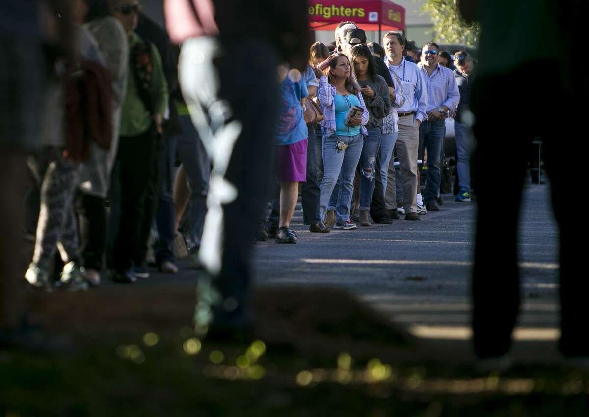 Voters wait in line on the last day of early voting at Brook Hollow Library, San Antonio's busiest precinct, on Friday, Nov. 2, 2018.