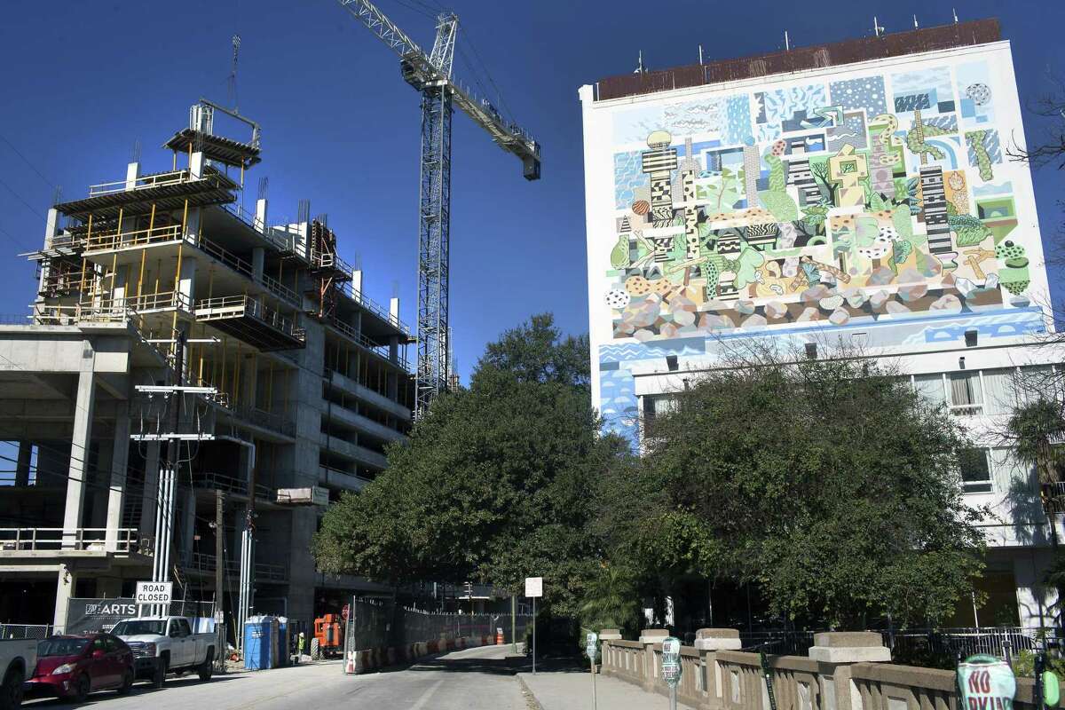 Work continues Thursday, Jan. 24, 2019 on the Arts Residences at the Thompson building, left, at 123 Lexington Ave in downtown San Antonio. Development firm DC Partners is building the high-rise with help from a $10 million incentive package from the Center City Housing Incentive Policy, a program that gives developers property tax rebates and construction loans to build housing in downtown San Antonio. The policy was a key component of Julian Castro's "Decade of Downtown."