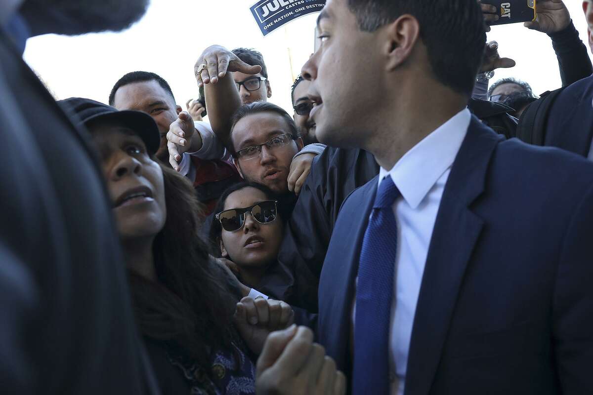 Jeanie Vasquez, center, and Robert Castaneda, wait to talk to Julian Castro, former HUD Secretary and former mayor of San Antonio, after he announced his run for President of the United States at Plaza Guadalupe in San Antonio on Saturday, Jan. 12, 2019. Vasquez and Castaneda hope to volunteer as field organizers.