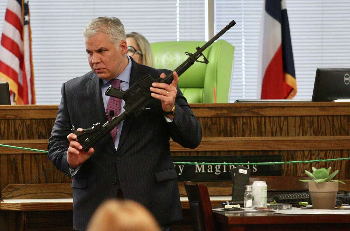Montgomery County District Attorney Brett Ligon discusses evidence with an expert during the murder trial of Rafael Leos-Trejo in state District Court Judge Patty Maginnis’ court in Conroe on Friday, Jan. 25, 2019, in Conroe. Trejo, of Spring, is charged with shooting and killing his wife Jessica Torres Leos.