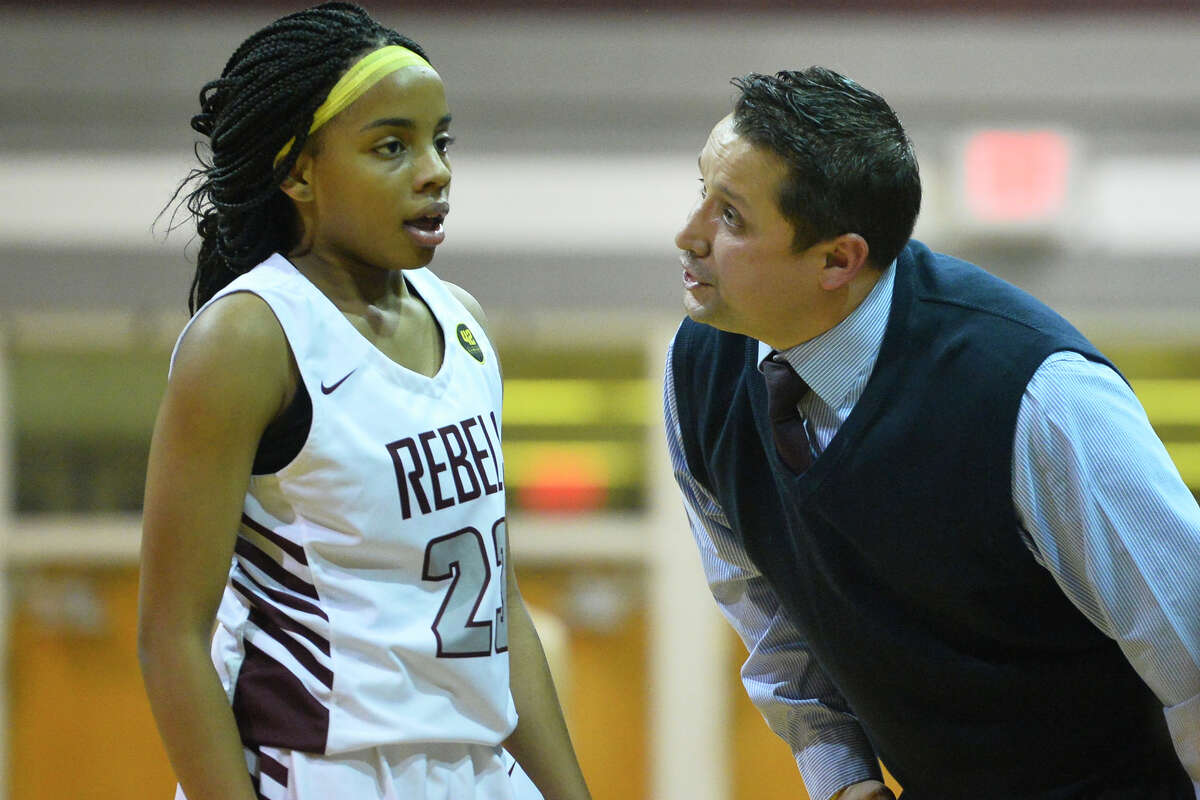Lee girls basketball head coach Alfred Acosta has words with Myleah Young as the Lady Rebels attempt to maintain a lead over Odessa in the final minutes of play Jan. 25, 2019, at Lee High School. James Durbin/Reporter-Telegram