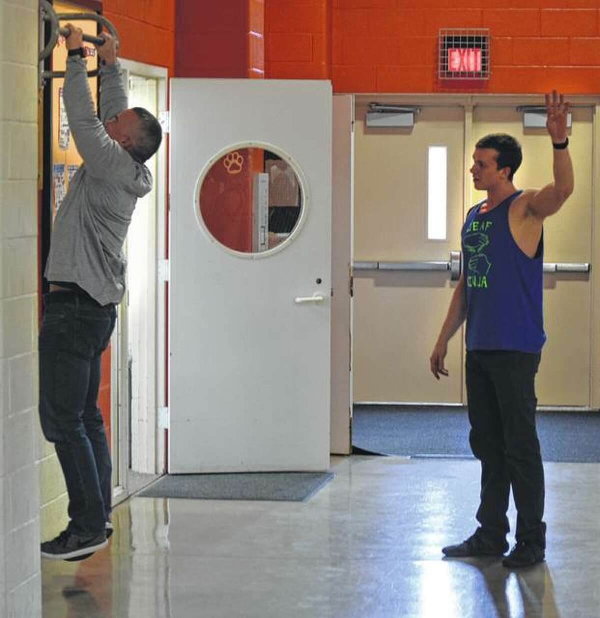 Illinois School for the Deaf High School teacher Jason Frye does as many pull-ups as he can in an attempt to outdo Kyle Schulze. Unfortunately, he was unable to beat the Ninja Warrior finalist.