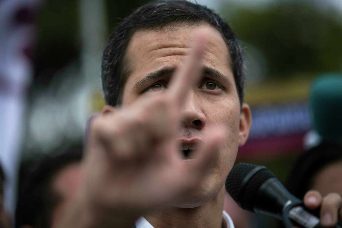 Venezuela's self-declared interim leader Juan Guaido speaks to supporters in a public plaza in Las Mercedes neighborhood of Caracas, Venezuela, Saturday, Jan. 29, 2019. Venezuela's political showdown moves to the United Nations where a Security Council meeting called by the United States will pit backers of President Nicolas Maduro against the Trump administration and supporters of Guaido.