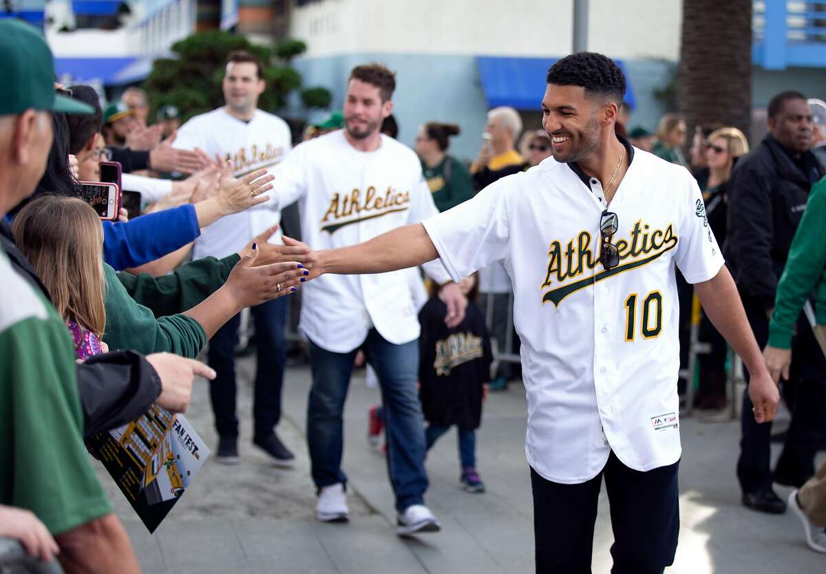 A's shortstop Marcus Semien (10) greets the fans at Oakland Athletics FanFest 2019, at Jack London Square in Oakland, Calif., Saturday, Jan. 26, 2019. A's supporters arrived by the thousands to see their favorite players, coaches and former stars as the club prepares for the new baseball season.