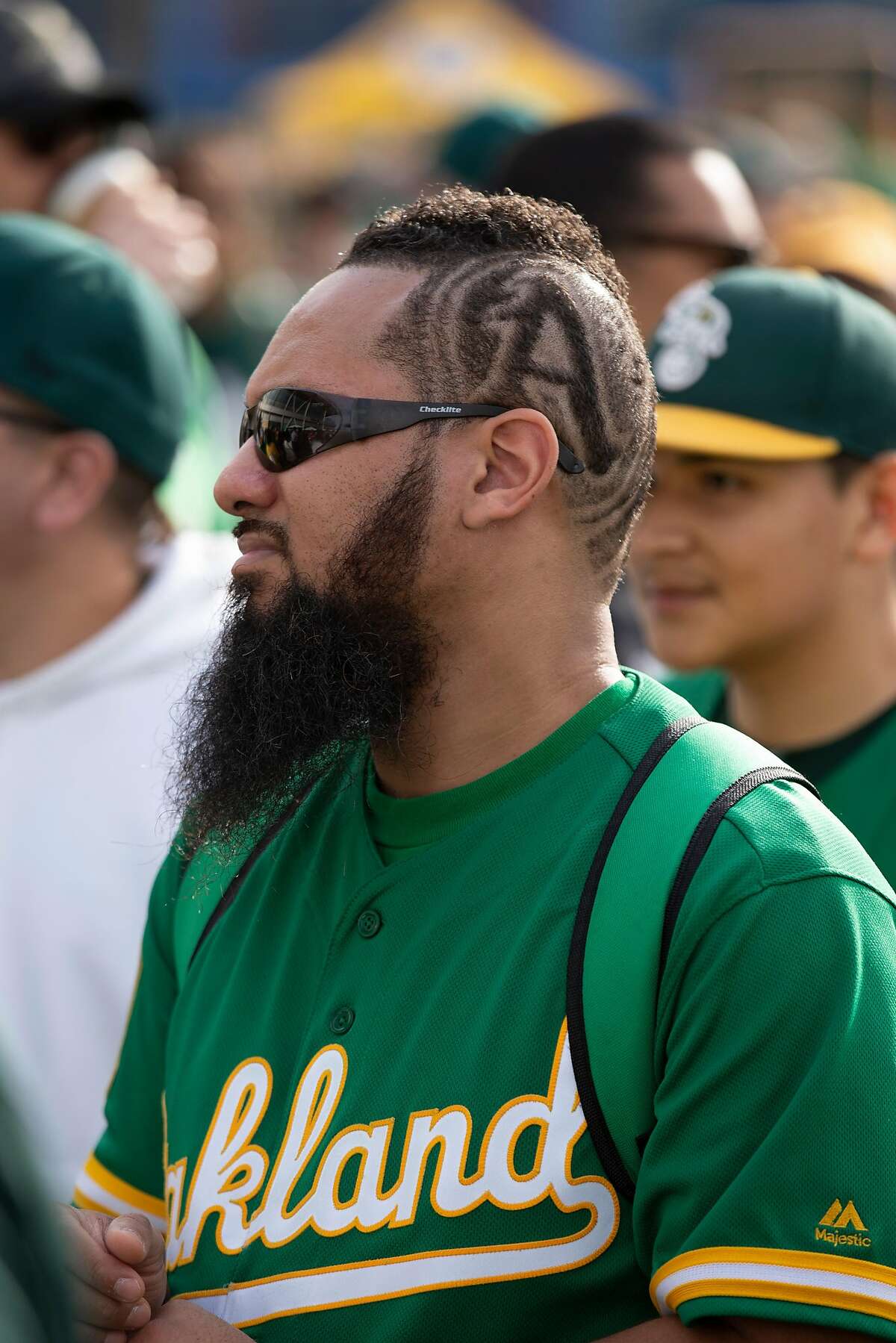Andre Arroyo of San Leandro, Calif. shows his A's devotion with a unique hairstyle, at Oakland Athletics FanFest 2019, at Jack London Square in Oakland, Calif., Saturday, Jan. 26, 2019. A's supporters arrived by the thousands to see their favorite players, coaches and former stars as the club prepares for the new baseball season.