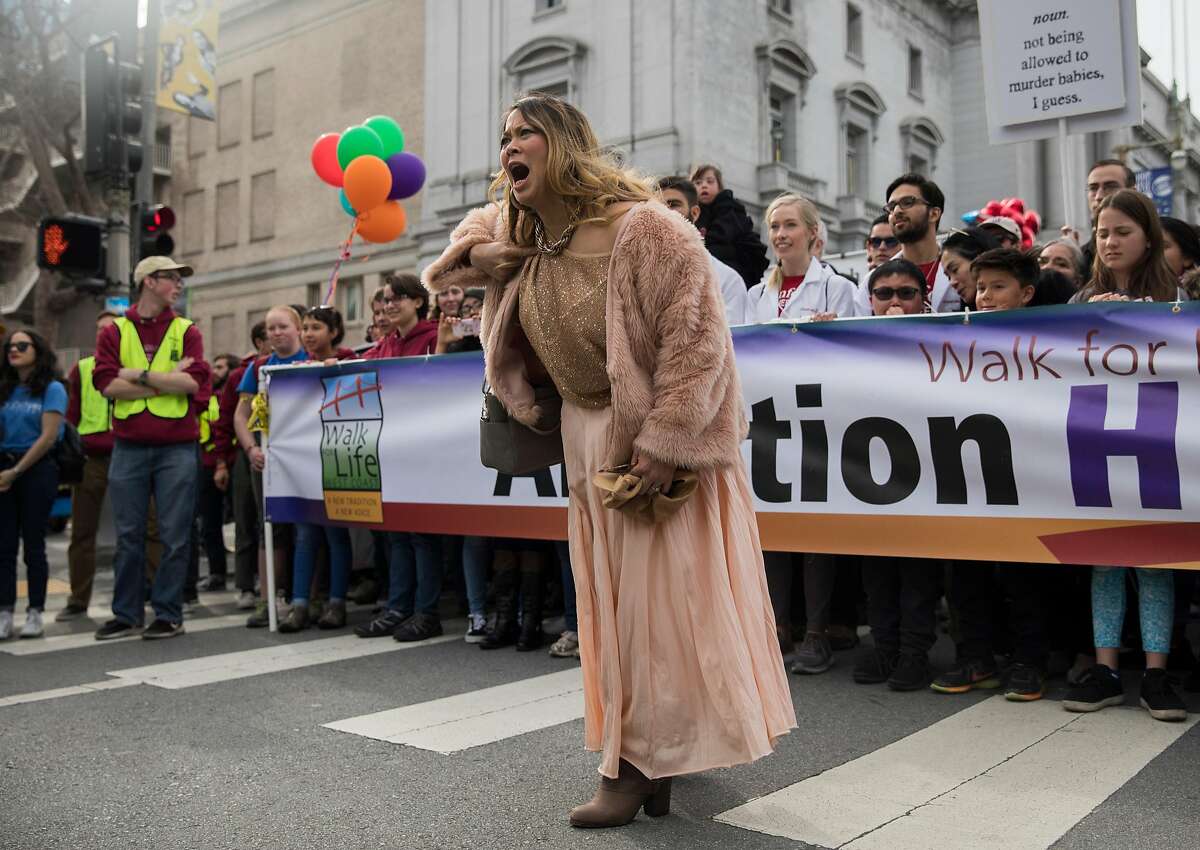 A counter-protester confronts anti-abortion activists during the annual anti-abortion Walk for Life event at Civic Center Plaza in San Francisco, Calif. Saturday, Jan. 26, 2019.