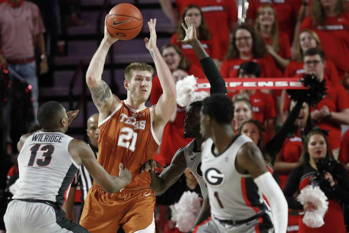 UT forward Dylan Osetkowski looks to pass out of a double team in Saturday’s loss to Georgia. The 98 points surrendered by Osetkowski and the Longhorns were the most in the Shaka Smart era.