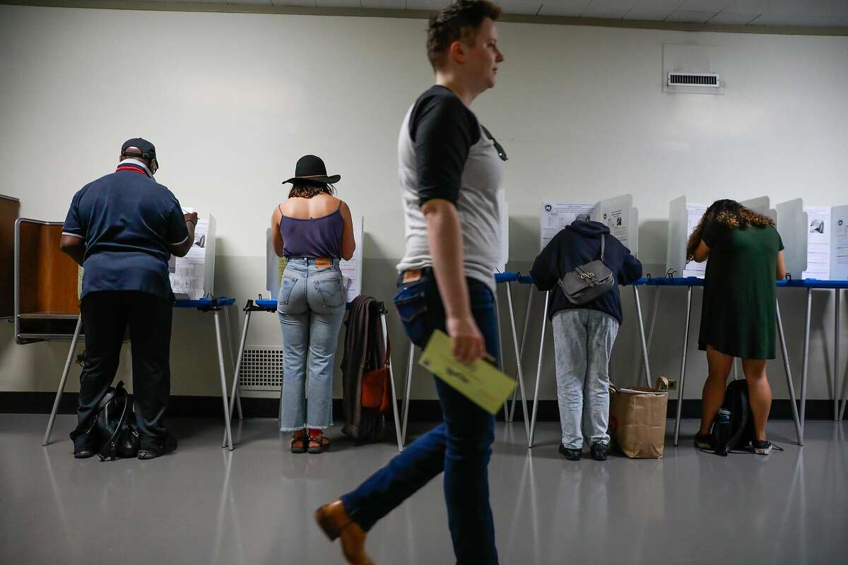People vote Registrar of Voters office in Oakland, California, on Monday, Nov. 5, 2018.