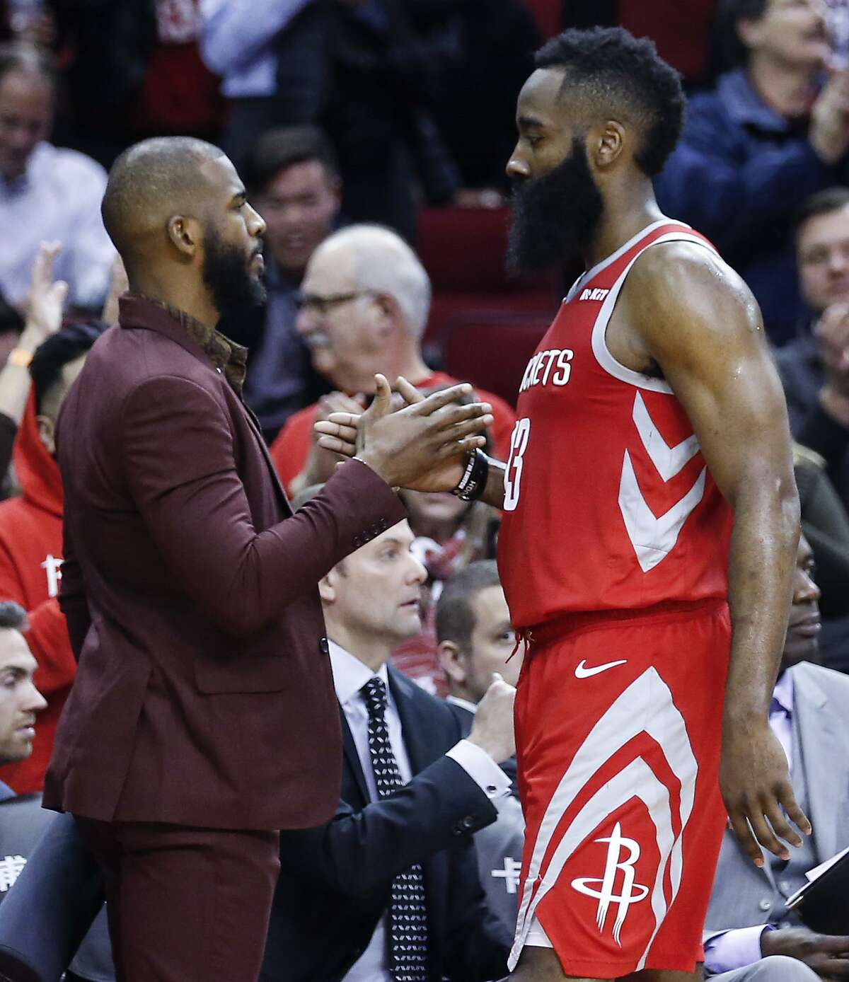 Rockets guard Chris Paul, left, and James Harden soon will shake hands on the court when Paul returns to action, maybe as soon as today.