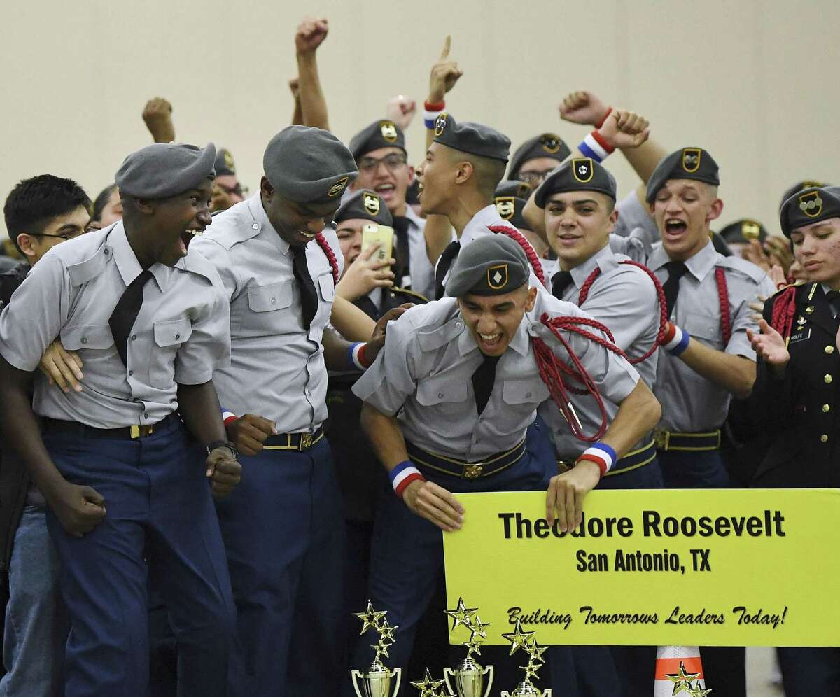Roosevelt High JROTC team members celebrate their overall championship in the armed category of the 5th Brigade Drill Team Championships at the Henry B. Gonzalez Convention Center on Saturday, Jan. 26, 2019.