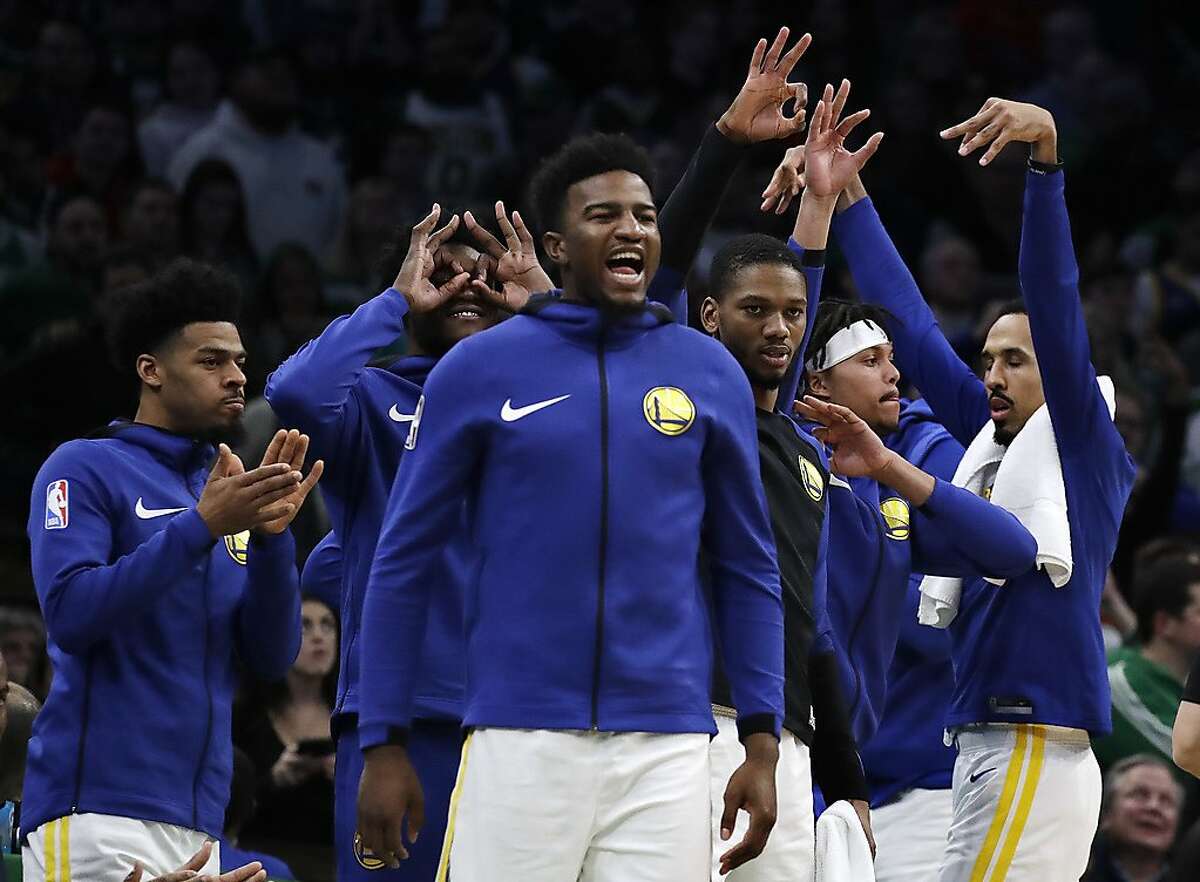 Golden State Warriors bench players celebrate late in the fourth quarter of an NBA basketball game against the Boston Celtics, Saturday, Jan. 26, 2019, in Boston. (AP Photo/Elise Amendola)