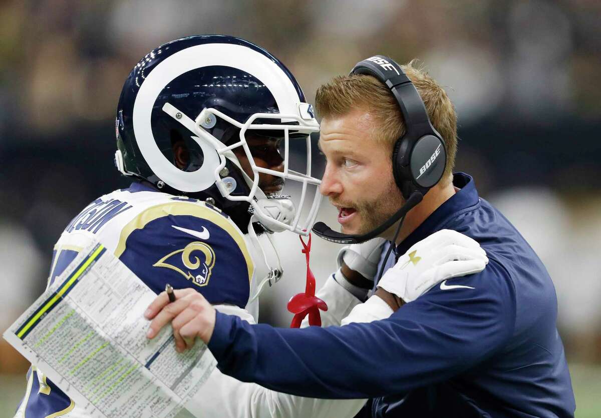 FILE- In this Jan. 20, 2019, file photo Los Angeles Rams head coach Sean McVay speaks with C.J. Anderson during the first half of the NFL football NFC championship game against the New Orleans Saints in New Orleans. The Los Angeles Rams and New England Patriots are bringing two of the top scoring offenses in the NFL to the Super Bowl.