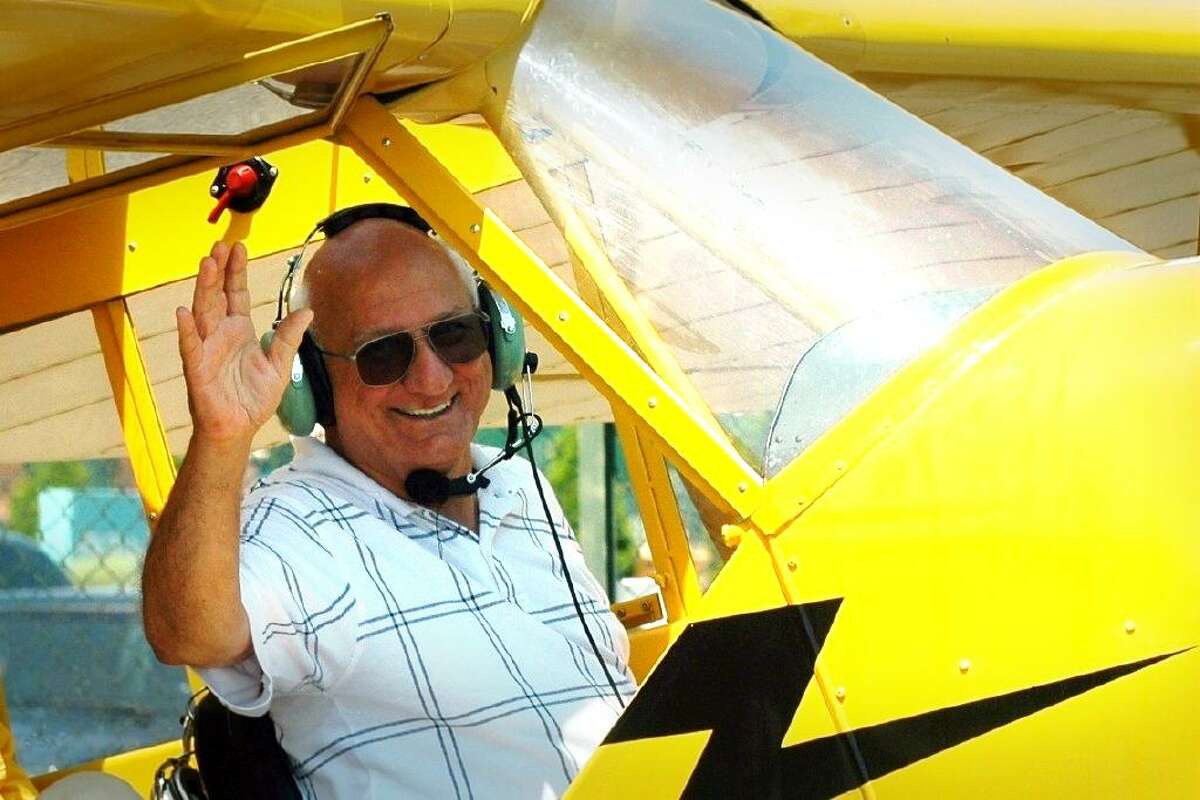 Morgan Kaolian, seen here in the cockpit of his Piper Cup, one of the many airplanes he flew out of Sikorsky Memorial Airport, in Stratford, for decades. Kaolian, 90, died Sunday at his home in Stratford after a long illness.