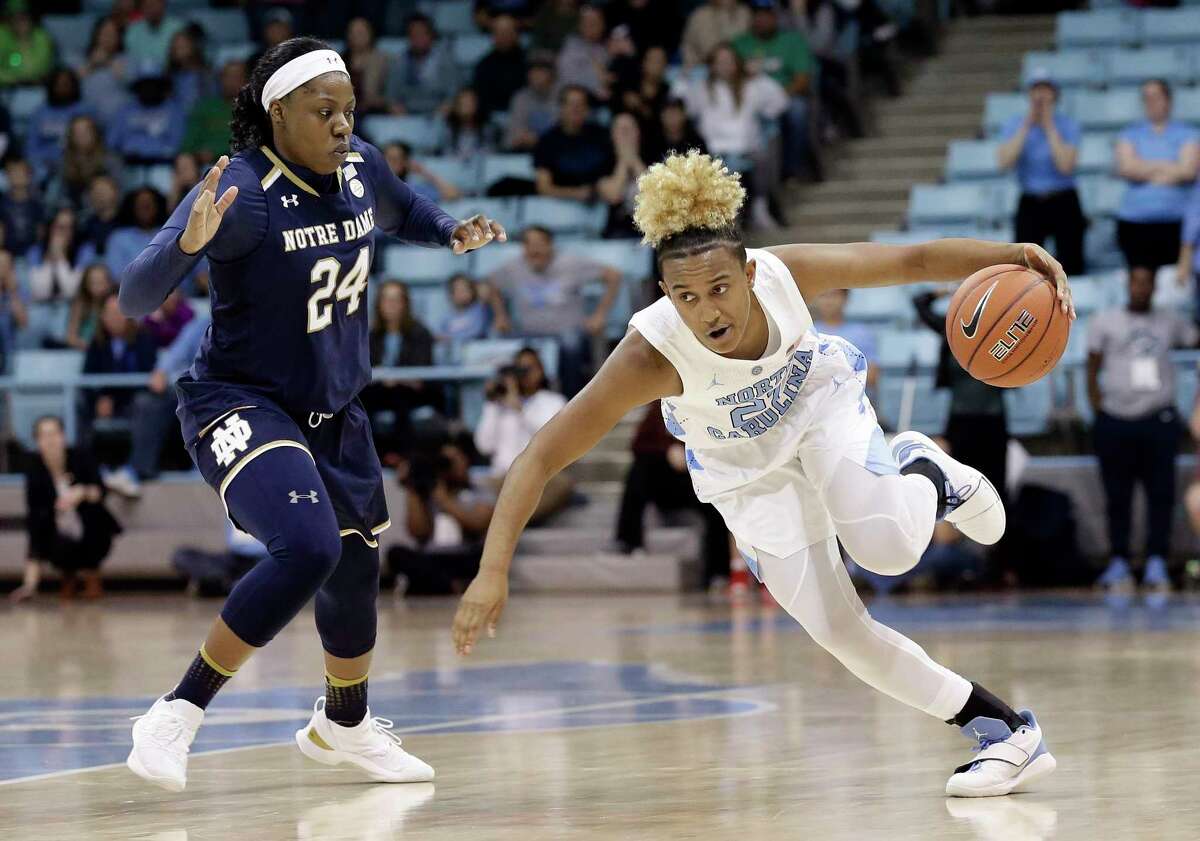Notre Dame's Arike Ogunbowale (24) guards North Carolina's Paris Kea during the second half of an NCAA college basketball game in Chapel Hill, N.C., Sunday, Jan. 27, 2019. North Carolina won 78-73. (AP Photo/Gerry Broome)