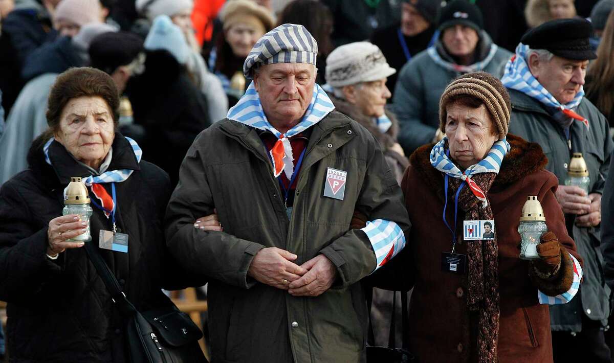 Survivors of Auschwitz arrive at the International Monument to the Victims of Fascism at the former Nazi German concentration and extermination camp KL Auschwitz II-Birkenau walk to place candles on International Holocaust Remembrance Day in Oswiecim, Poland, Sunday, Jan. 27, 2019.(AP Photo/Czarek Sokolowski)
