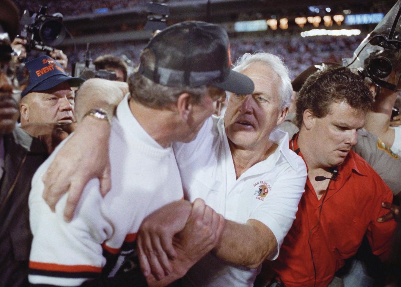 San Francisco, California, USA. 17th Dec, 1989. San Francisco 49ers vs  Buffalo Bills at Candlestick Park Sunday, December 17, 1989. 49ers beat  Bills 21-10. 49er Head Coach George Seifert gets help from