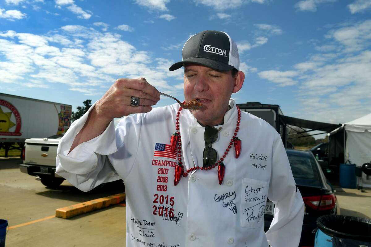 Patrick Bourgeois, of Katy, taste tests his chili before turn in time for the chili cook off.