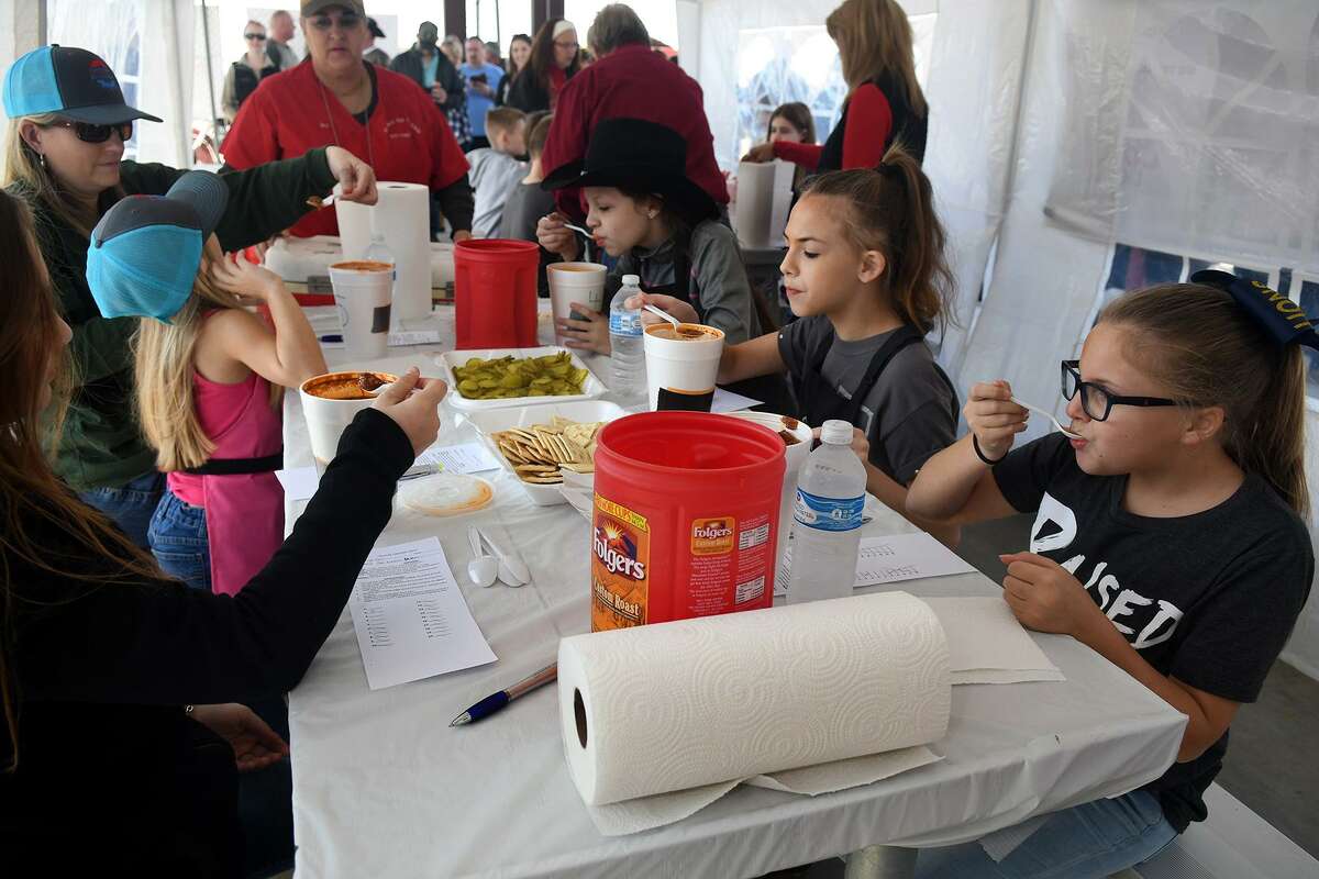 Kaitlyn Clare, 9, from right, a 4th grader at Keenan Elem., Ashlynn Cannon, 12, a 6th grader at Smith Middle School, and Lily Escobar, 11, a 6th grader at Spillane Middle School, lead the judging of the Junior Chili entries during the Houston Metro Go Texan Cypress Fairbanks Subcommittee Annual Bar-B-Que & Chili Cook Off at Trader's Village in Houston on Jan. 26, 2019.