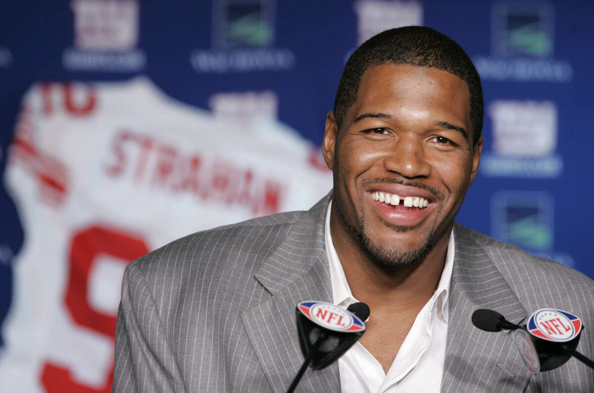 In this June 10, 2008 file photo, New York Giants Michael Strahan talks about his retirement from football during a news conference at Giants Stadium in East Rutherford, N.J. Strahan has the New York Giants waiting again. A year after making them wait an entire training camp on a retirement decision, No. 92 has the Super Bowl champions waiting to see if he will come out of retirement. (AP Photo/Mike Derer)