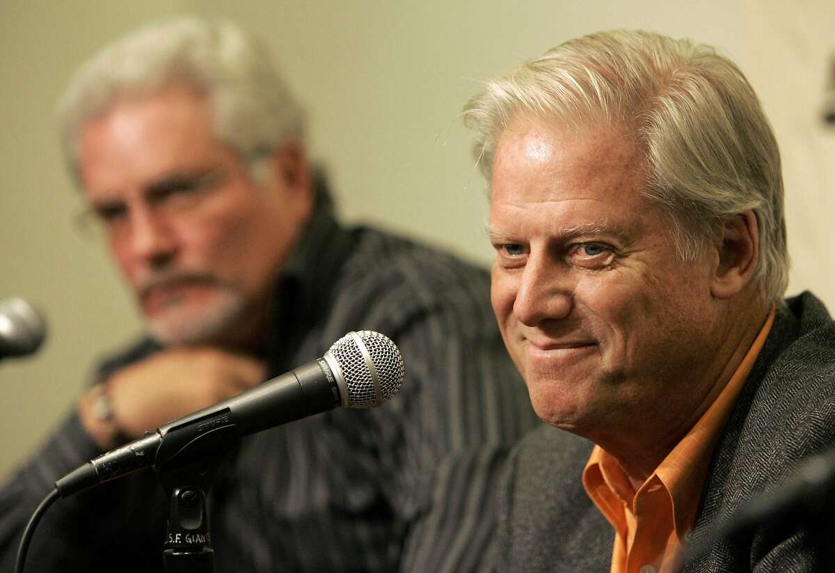 File-This Sept. 21, 2007, file photo shows San Francisco Giants' owner Peter Magowan, right, and general manager Brain Sabean speaking at a news conference in San Francisco, Friday, Sept. 21, 2007. The longtime San Francisco Giants owner has died at the age of 76. The team said Magowan died Sunday, Jan. 27, 2019, after a battle with cancer. (AP Photo/Jeff Chiu, File)