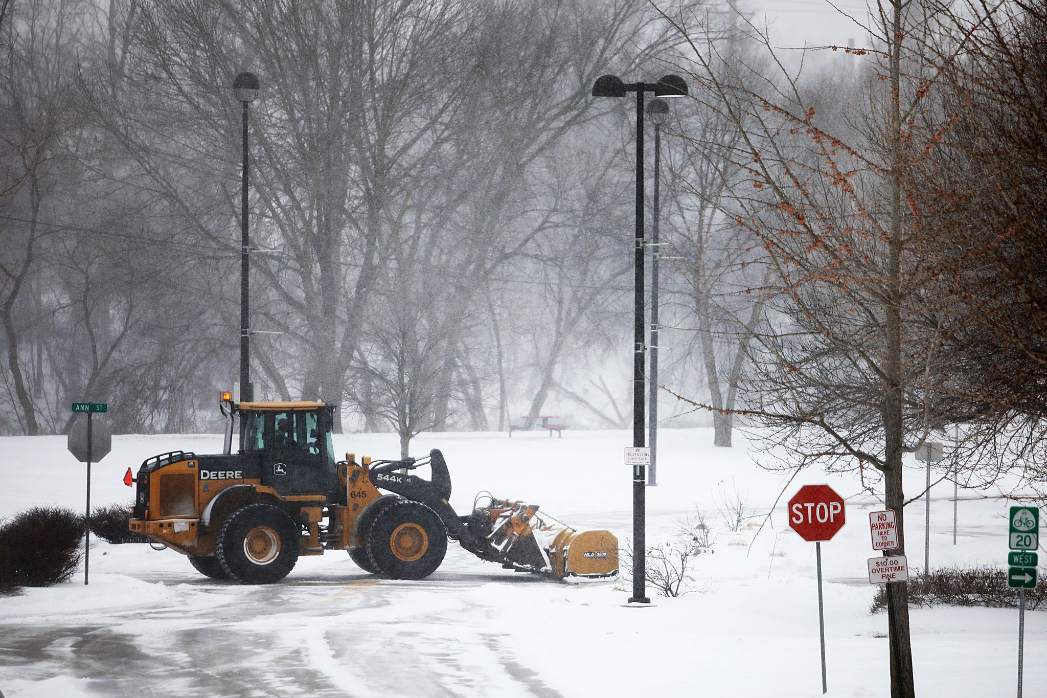 Semi truck hits snow plow as storm takes hold