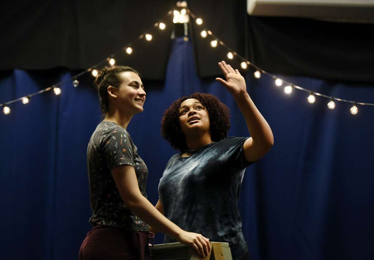 LeighAnn Cannon (left) and Loreigna Sinclair prepare for the musical “She Persisted.”